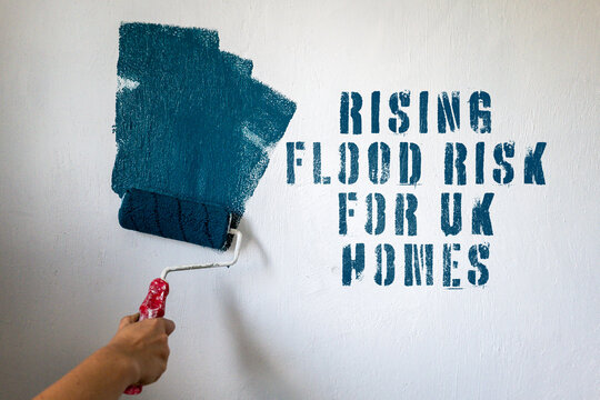 RISING FLOOD RISK FOR UK HOMES Climate Warning Painted on Wall