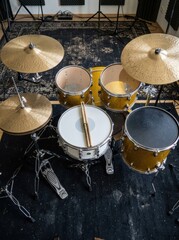 Obraz premium Professional Gold Sparkle Drum Kit with Snare and Cymbals in Music Recording Studio Top View