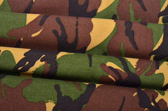 JAKARTA, INDONESIA - September 26 : Camouflage DPM Pattern Fabric Texture Background with Soft Folds and Drapes