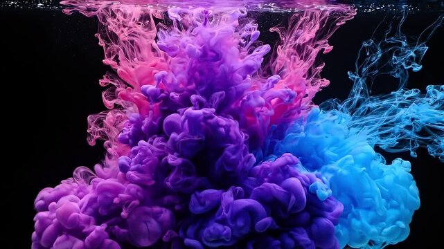 Colored ink clouds collide and blend underwater. Abstract fluid dynamics showing vivid pigment diffusion through water.