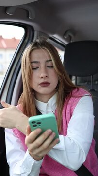 Vertical screen confused passenger tries to guide the driver using a phone map but cannot understand the route or explain where to turn while traveling through an unknown area