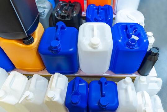 Blue and white plastic barrels contain in plant