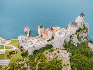 Fototapeta premium bird's-eye drone perspective reveals the full stone layout of Golubac Fortress jutting into the Danube