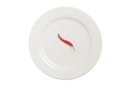 Single red chili pepper lying on empty white plate isolated on transparent background