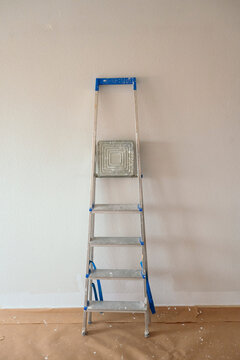 Painter ladder against wall during home renovation