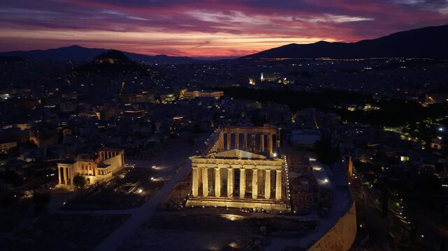 Drone night shot of illuminated Parthenon on the Acropolis hill in Athens, capital of Greece, aerial night view of Greek capital, tourism and travel in Greece