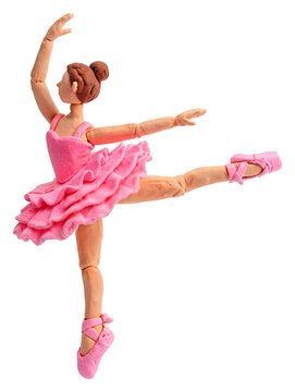 Handmade clay ballerina in pink tutu performing a graceful ballet pose