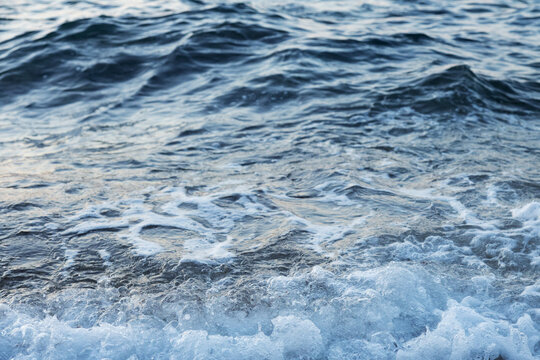 Ocean waves with foamy sea water surface texture