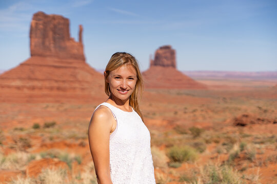 Woman traveler at Monument Valley desert landscape