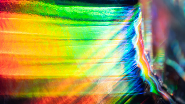 Abstract rainbow light streak with holographic glass texture