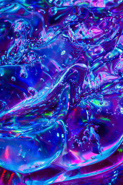 Iridescent liquid texture with neon blue and magenta glow