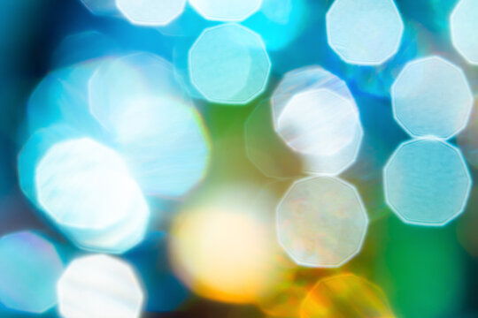 Abstract blue bokeh background with colorful blurred light