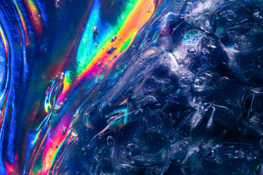 Iridescent rainbow light refract through textured ice