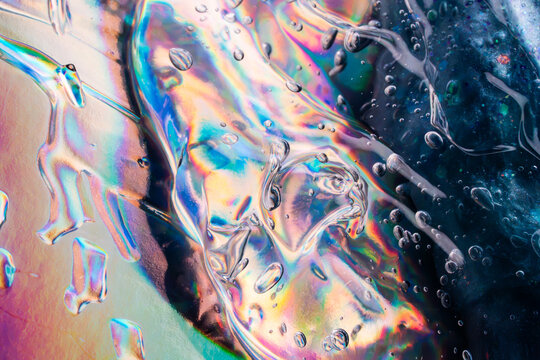 Iridescent water droplet texture with colorful abstract refraction