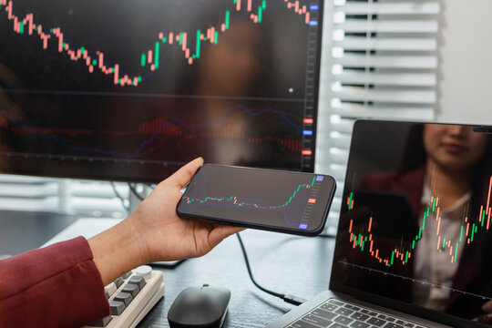 Professional investor monitoring financial markets and analyzing investment opportunities in a modern office, representing stock trading, market research, portfolio management.