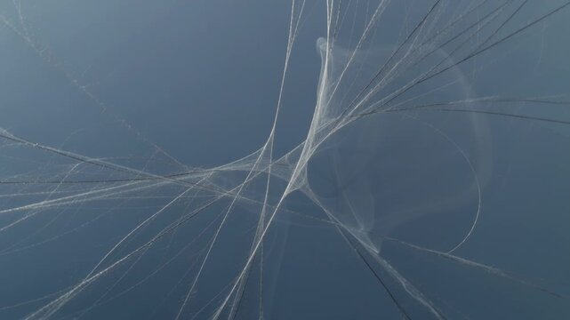 Swaying translucent canopy shifting and smoothing in clear sky, driven by wind and suspension lines