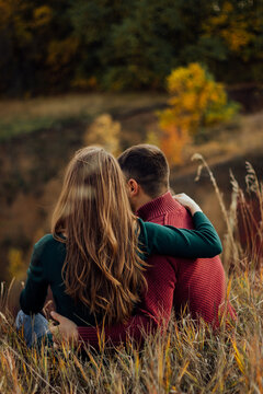 Couple embracing in autumn outdoor natural setting