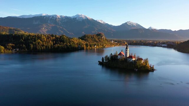 Panoramic drone view of Lake Bled island and mountains