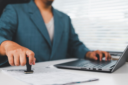 A corporate lawyer uses a legal stamp to approve contract authorization, ensuring document verification, compliance approval, business agreement validation, corporate governance, regulatory process