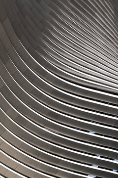 Curved facade with geometric lines in contemporary architecture
