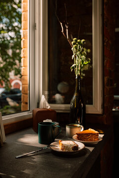 Morning coffee and cake by a sunlit window