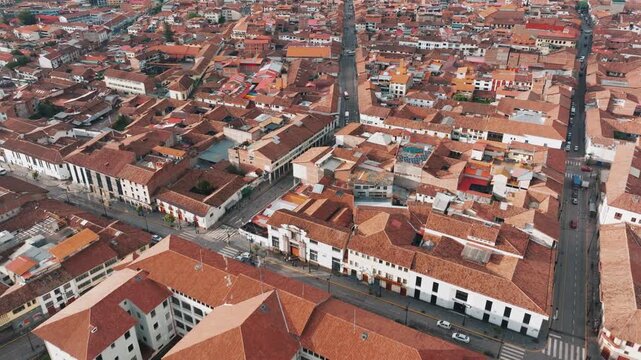 Scenic aerial drone view over historic Cusco city and the surrounding Andes Mountains in Peru