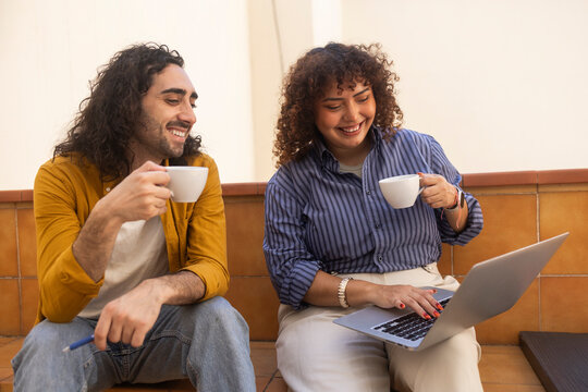 Coworking office team enjoy coffee and laptop work break