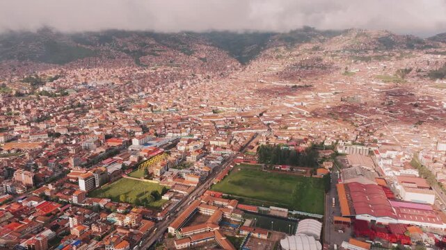Picturesque aerial drone view over historic Cusco city and the surrounding Andes Mountains in Peru