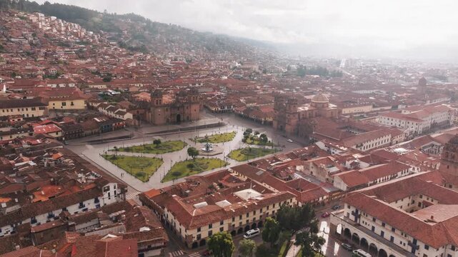Detailed aerial drone view over historic Cusco city and the surrounding Andes Mountains in Peru