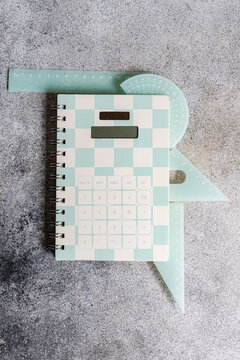 Pastel calculator notebook and ruler for school learning tools