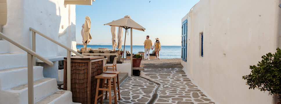 Discovering the charm of Naousa in Paros, Greece on a serene coastal pathway