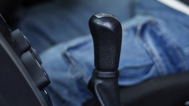 close up hand of car gear stick selector 5 speed. concept transport travel.