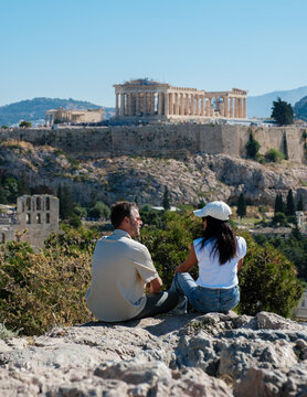 Couple enjoying the breathtaking view of the Acropolis in Athens, Greece