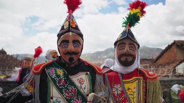 Cinematic view of colorful traditional festival masks displayed in historic Cusco, Peru