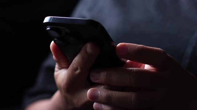 woman holds smart phone in her hands and scrolls through the news feed. Close up of hand uses mobile. point finger on screen, texting text message.