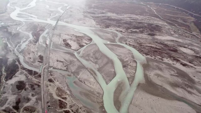 High angle braided river channels and pale sediment patterns