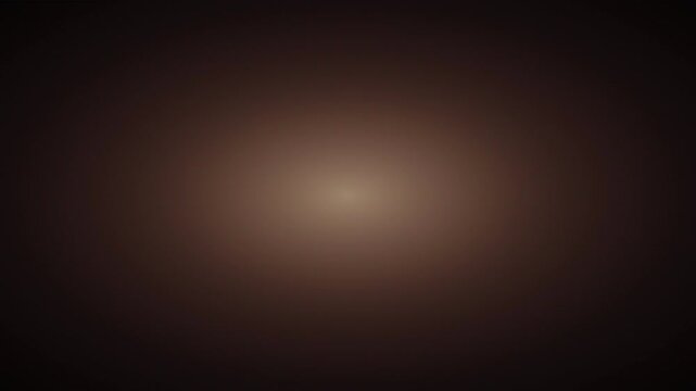 dark brown gradient background featuring a soft centered lighting glow for elegant visual design and copy space