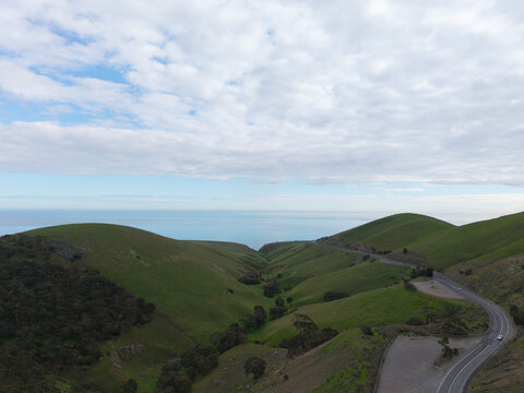 Aerial view of rolling green hills and a coastal ravine in South Australia