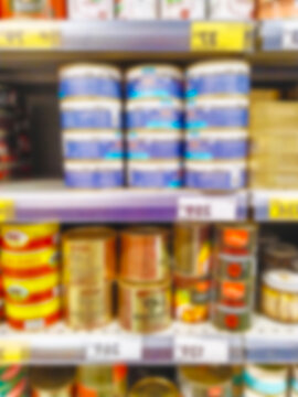 CPG blurred grocery shelf background. Abstract retail store interior backdrop template. Modern supermaket aisle layout display presentation header. Defocused consumer products advertising