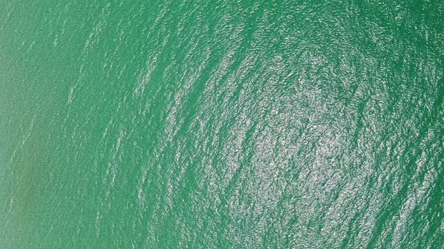 Idyllic summer vacation. Caribbean sea. Aerial view. Rippled surface. Sea water surface. Ripple water of ocean. Aquamarine ocean nature. Background of clear turquoise sea water shining on sunlight