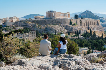 Fototapeta premium Couple enjoying breathtaking views of the Acropolis in Athens, Greece