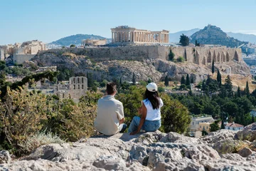 Couple enjoying breathtaking views of the Acropolis in Athens, Greece © Fokke Baarssen