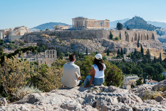 Couple enjoying breathtaking views of the Acropolis in Athens, Greece