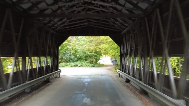 Flying a drone through an old wooden covered bridge