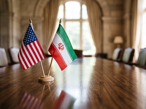 desktop flags of the usa and iran stand on a wooden table in a classic boardroom symbolizing political dialogue diplomatic relations and international negotiations