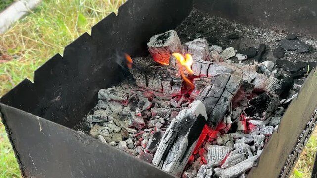 red-hot coals in the barbecue grill. High quality 4k footage