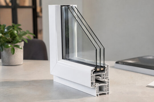 Triple glazed window cross section on an architect desk