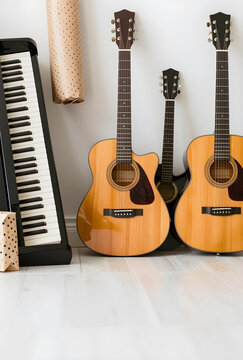Music education and creative hobby, acoustic guitars and digital piano keyboard in a home studio for learning musical instruments and artistic practice