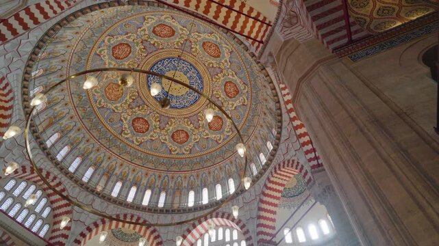 View of the intricate dome and ornate architectural details inside the historic Selimiye Mosque in Edirne Merkez, Edirne, Turkiye.