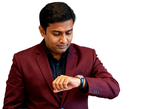 Indian man in maroon blazer checking silver watch, conveying focused punctuality, isolated transparent background, ideal for business efficiency.